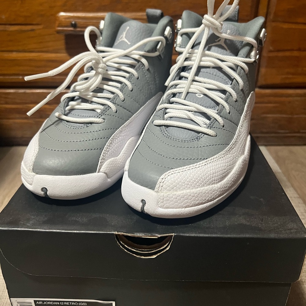 Jordan 12 (GS) Women's Sneakers in Gray and White